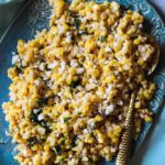 Mexican corn salad recipe served on a turquoise platter