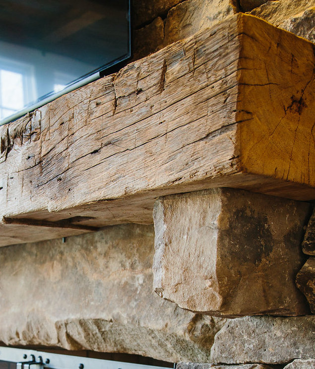 Custom Mantle of Reclaimed wood by High Mountain Millwork Company
