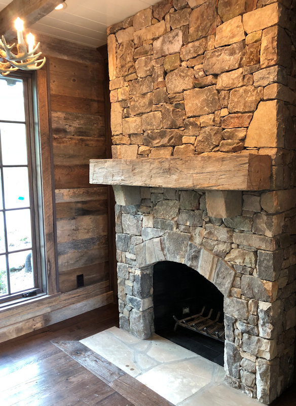 Custom Mantle of Reclaimed wood by High Mountain Millwork Company