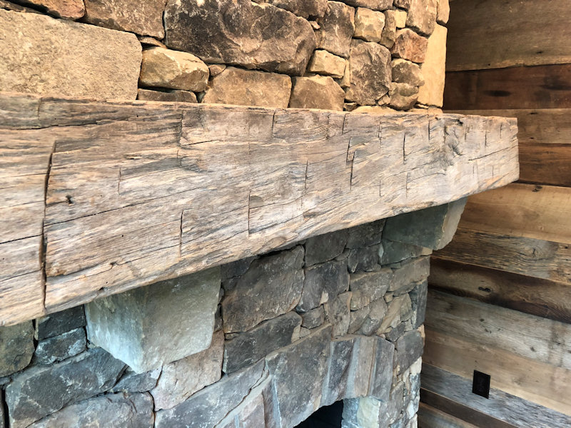 Custom Mantle of Reclaimed wood by High Mountain Millwork Company