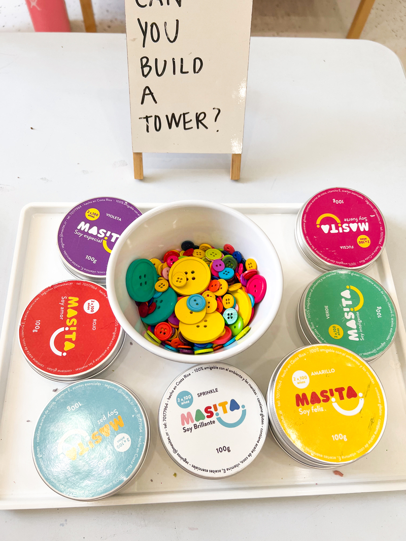 Can you make a tower with buttons and play dough?