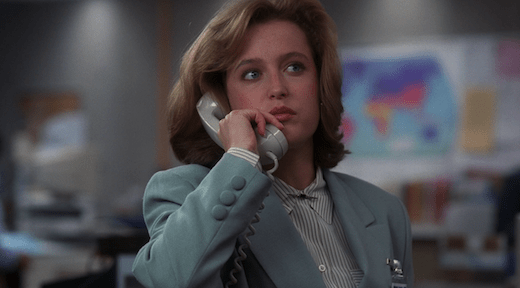 Scully talks on the phone with Mulder.