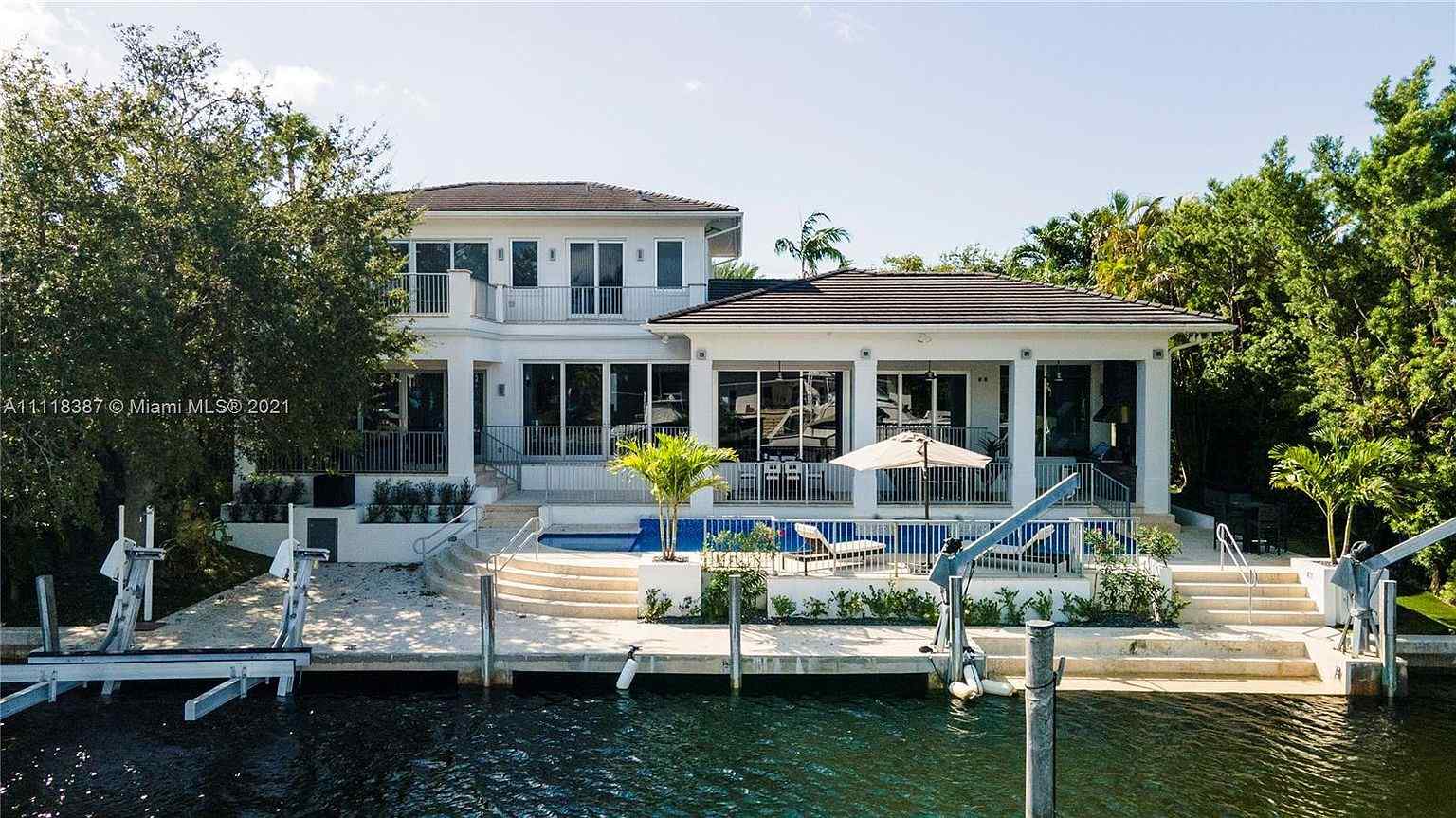Home Of The Day A Luxe Waterfront Estate In Prestigious Gables By The Sea