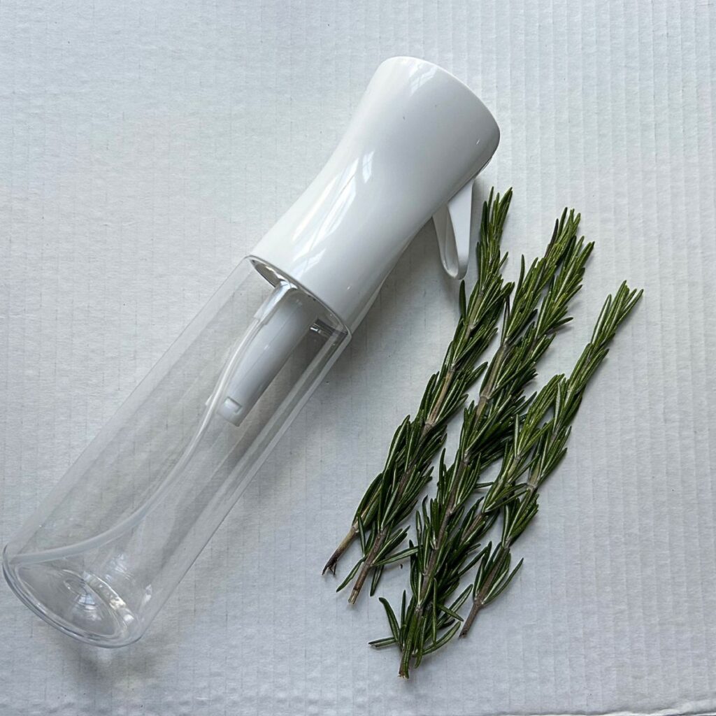 empty spray bottle and rosemary