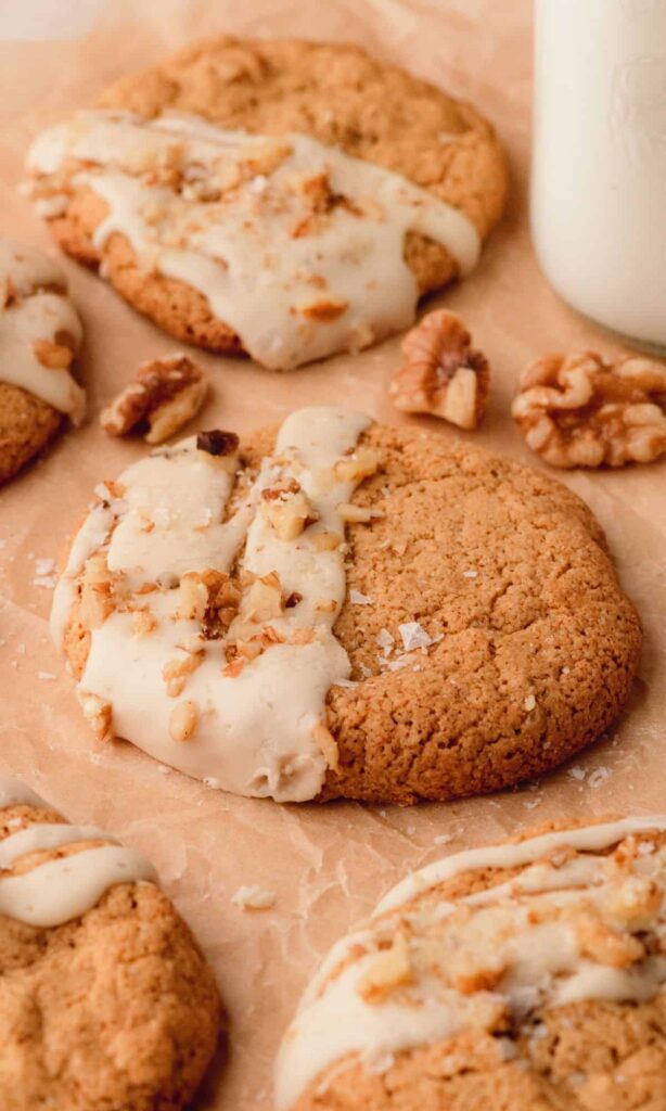 walnut spice cookies with a maple glaze drizzle and walnuts