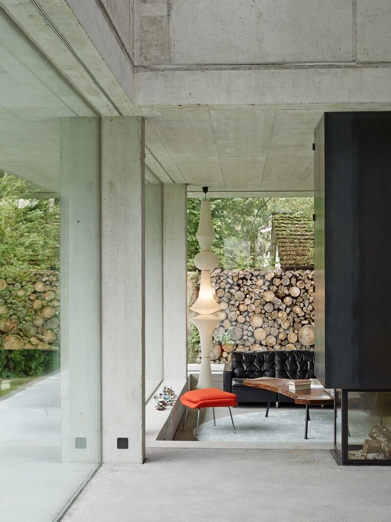 The Architecture Of This Family House Combines Raw Concrete With Dark Wood