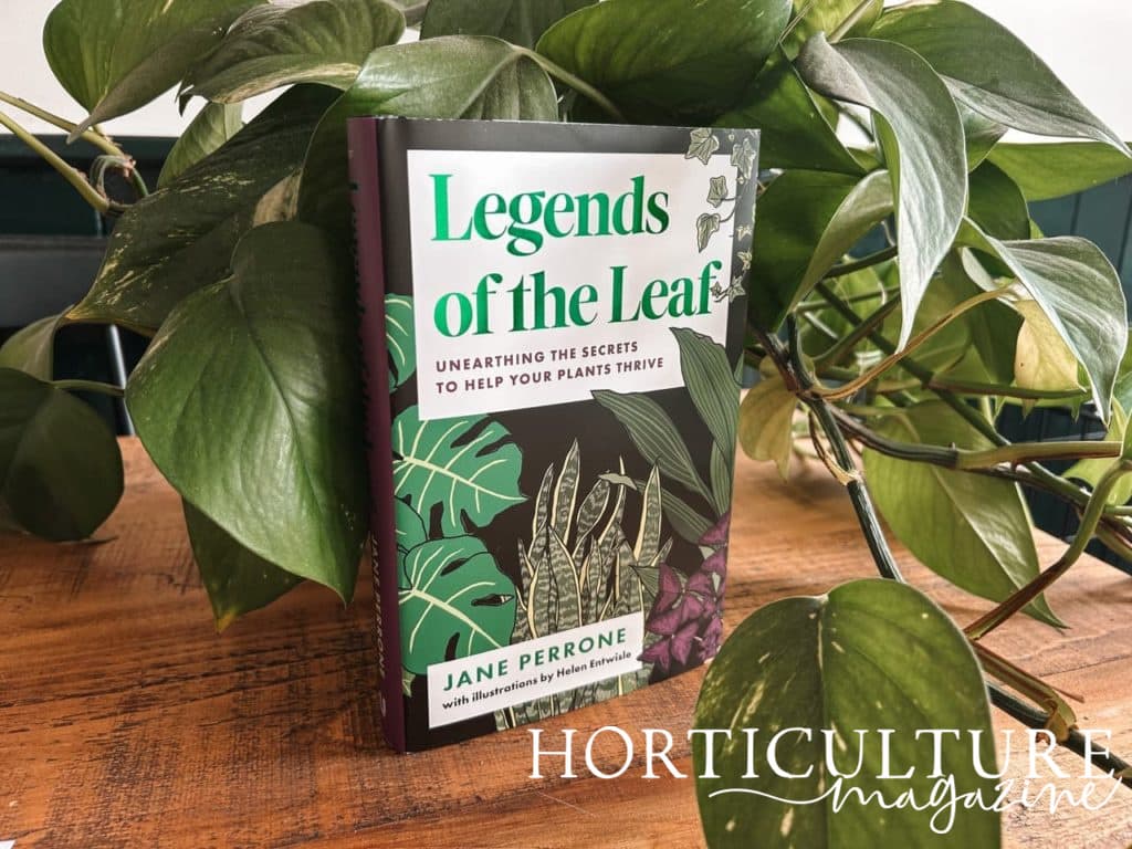Legends of the Leaf by Jane Perrone stood up next to a devils ivy houseplant