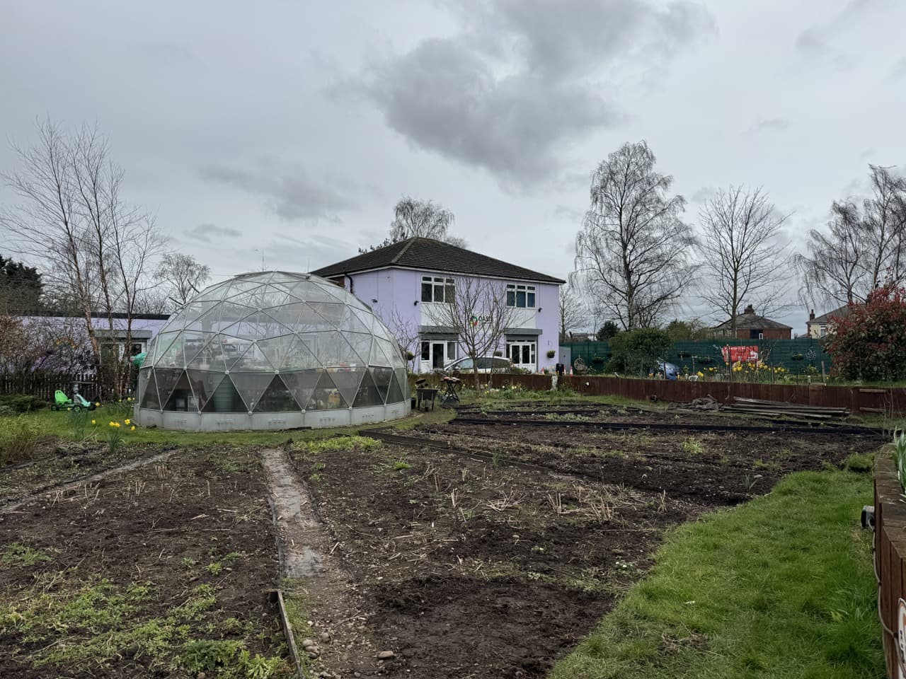 the oasis community centre with the greenhouse at the forefront