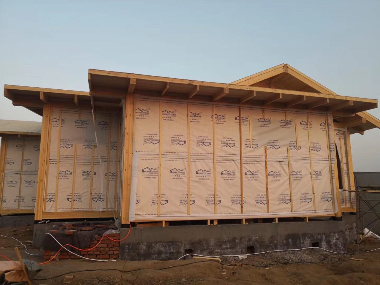 Comparing Home Construction House Wraps Jinbo vs. Tyvek Xiashi Packing