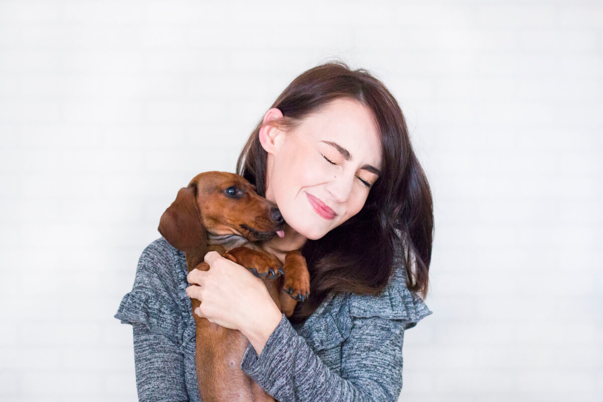 (7 REASONS) Why Does My Dog Wrap Her Paws Around Me Dog