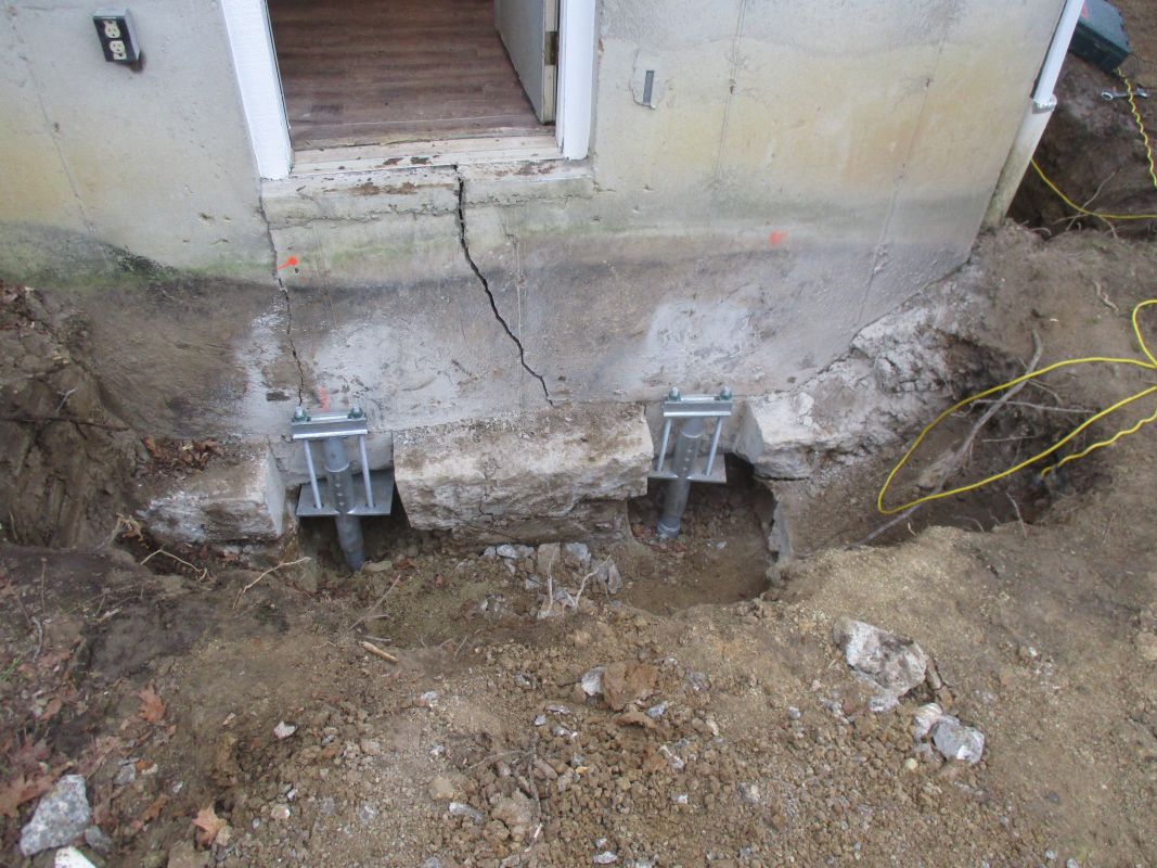 Helical Piers to Reduce Foundation Movement - Hughes Construction