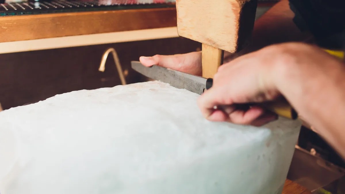 bartendercuttingblockicewithknifeandmallet Hunting Waterfalls