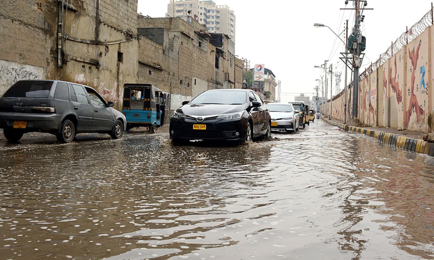 In pictures Rain brings respite from suffocating heat to Karachi