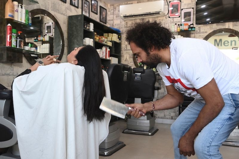 Lahore barber offers hairraising cuts with cleavers and blowtorches