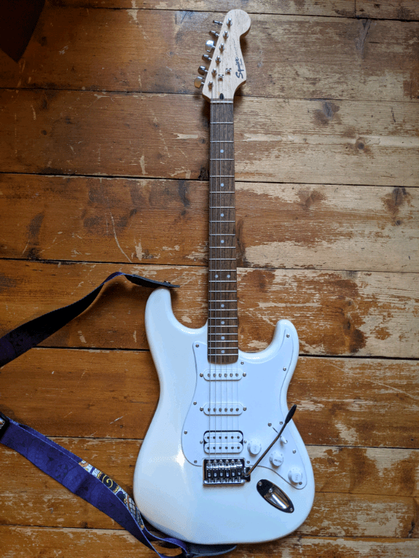 Fender Squier Bullet Strat electric guitar and Champion 20 amp in