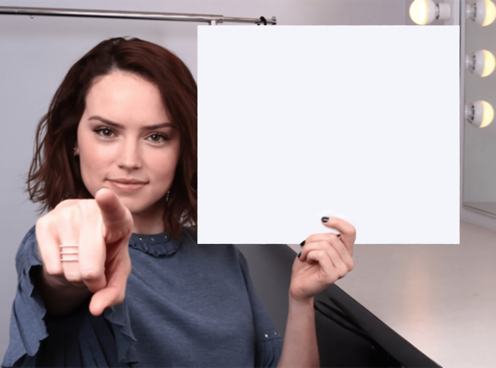 Daisy Ridley with a blank sign pointing at you (tilt corrected) Memes Imgflip