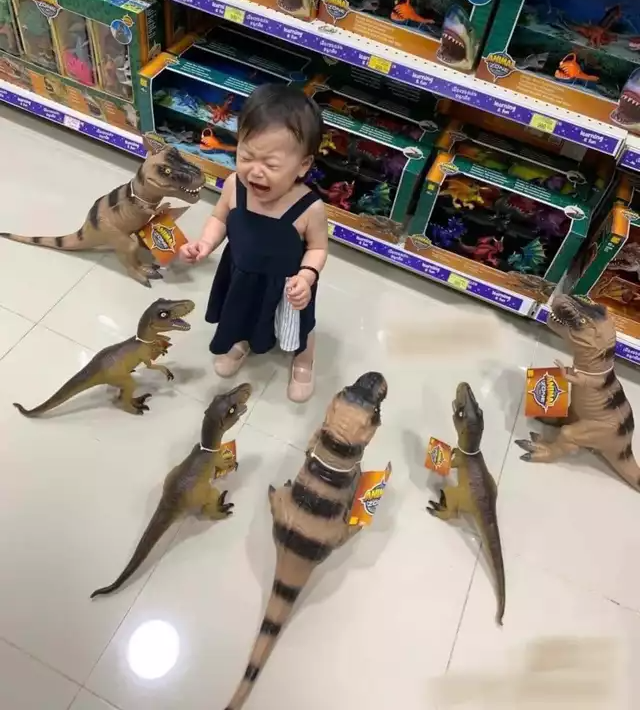Child surrounded by dinosaurs Memes Imgflip