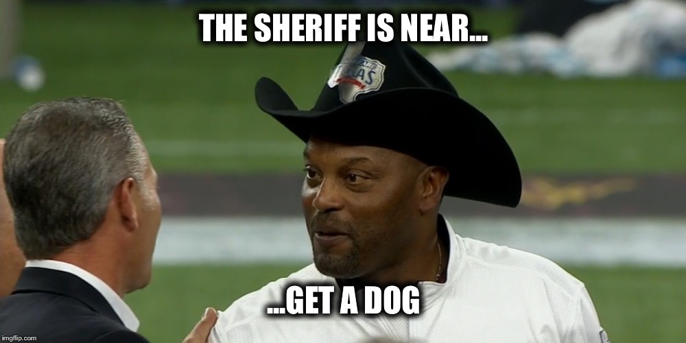 Sumlin in the big black cowboy hat...CAPTION THIS TexAgs
