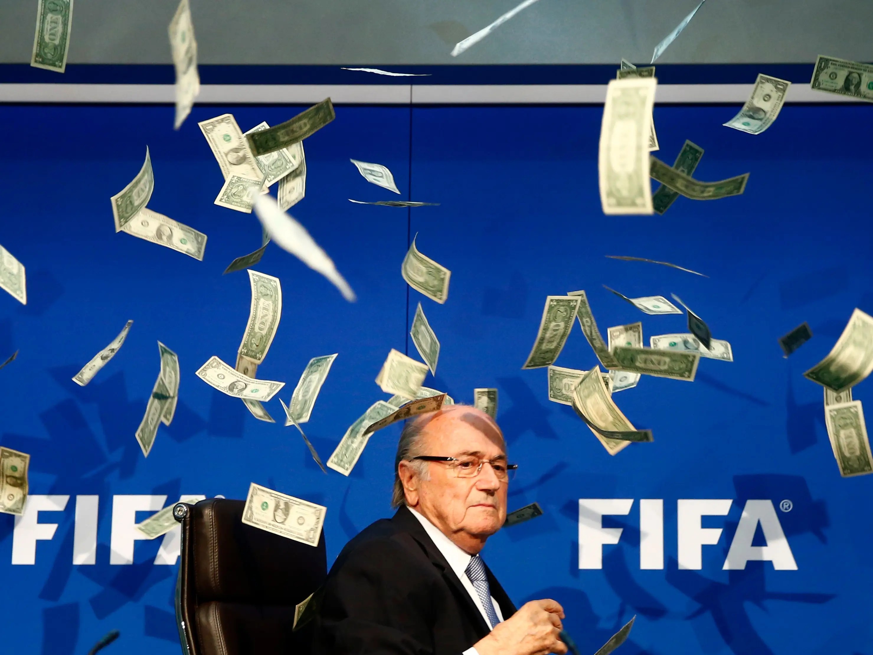 VIDEO Protester Throws Money at FIFA President Sepp Blatter During Press Conference