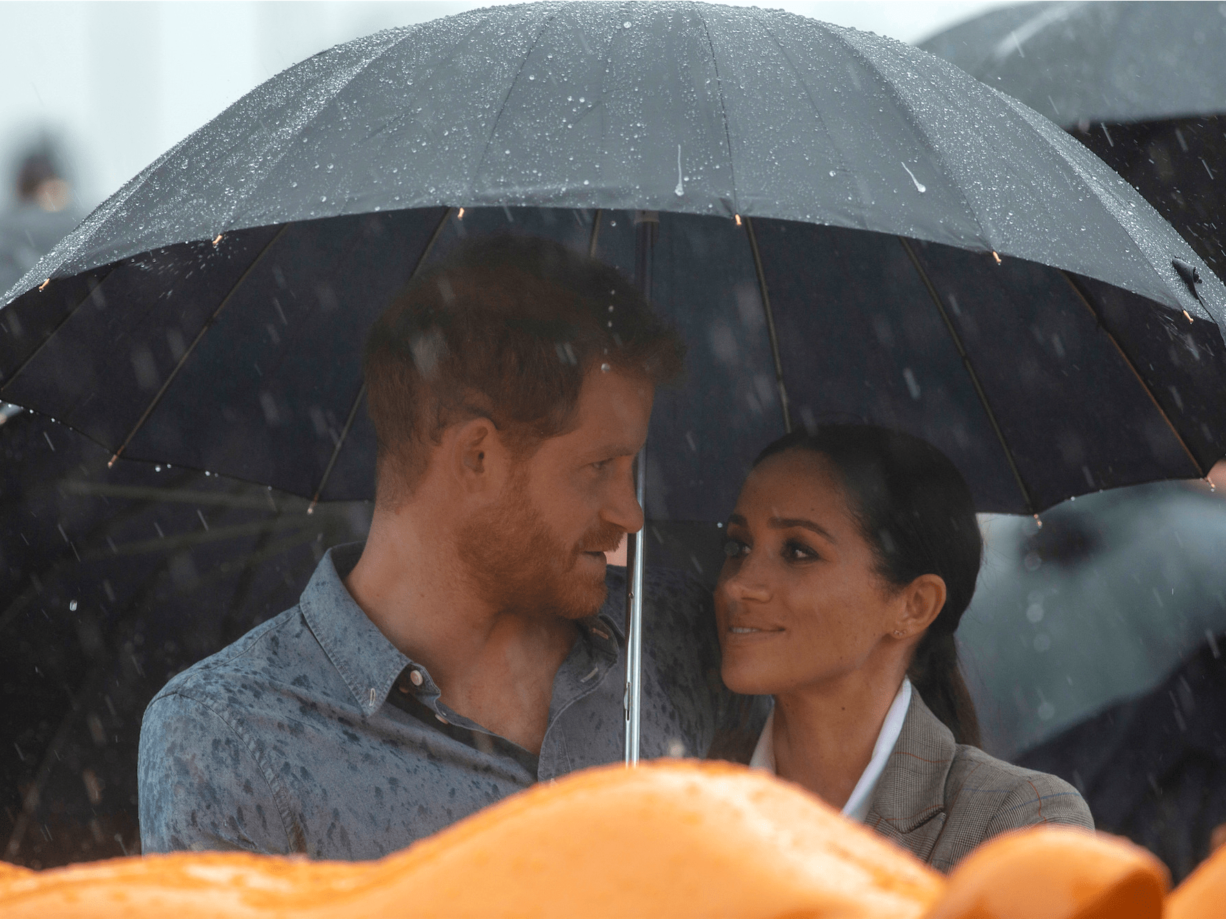 Prince Harry and Meghan Markle Share Umbrella During Royal Tour