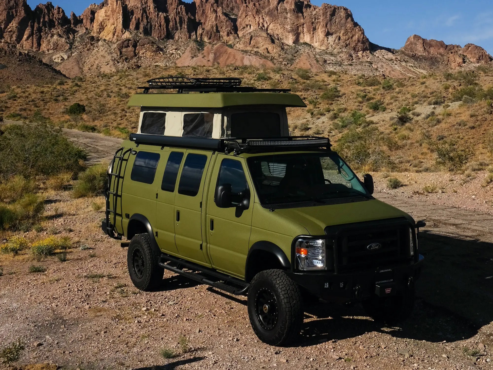 This offroad Ford camper van has a 'penthouse' roof for up to 225,000