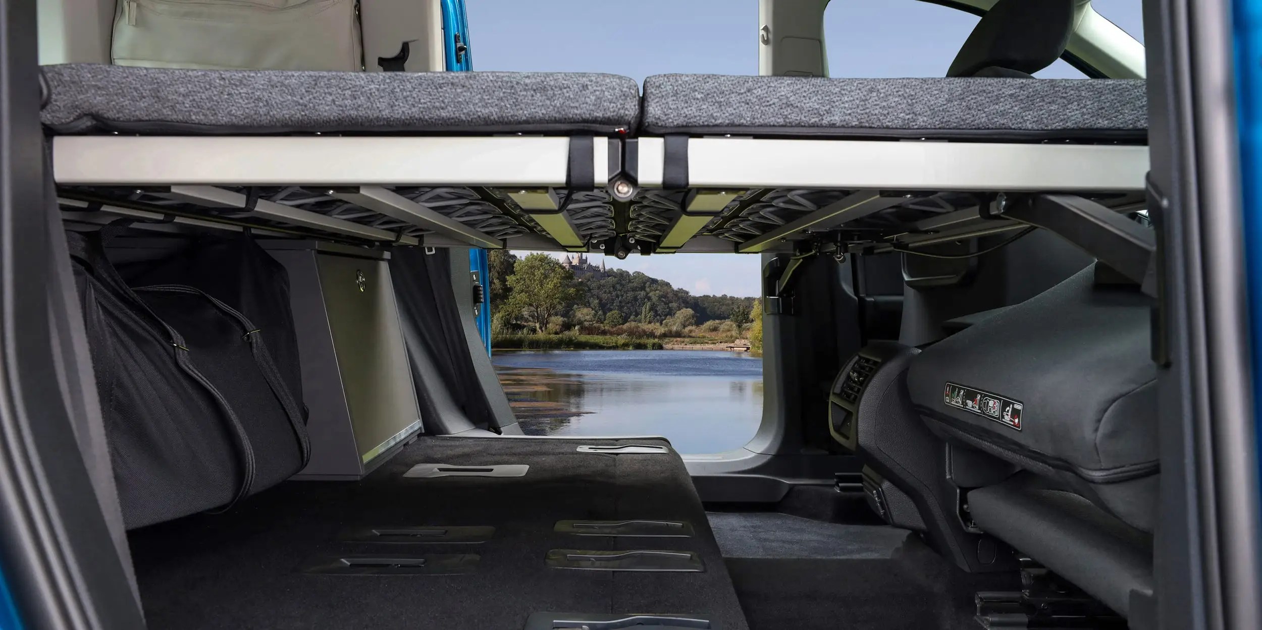 Volkswagen has unveiled its Caddy California camper van with a bed and kitchen — see inside