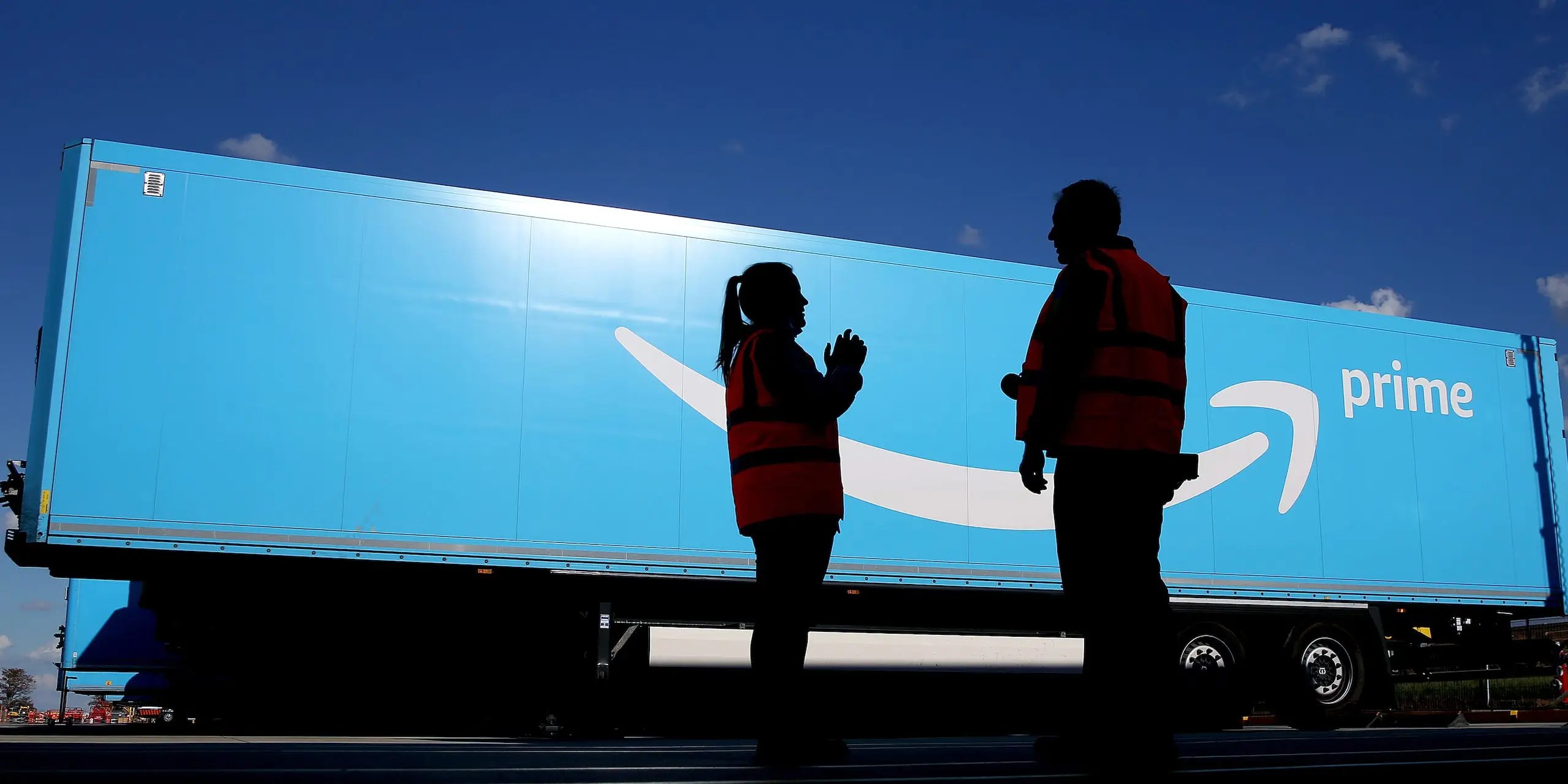 Amazon plans a pay cut of up to 23 for hourly workers who guide trucks