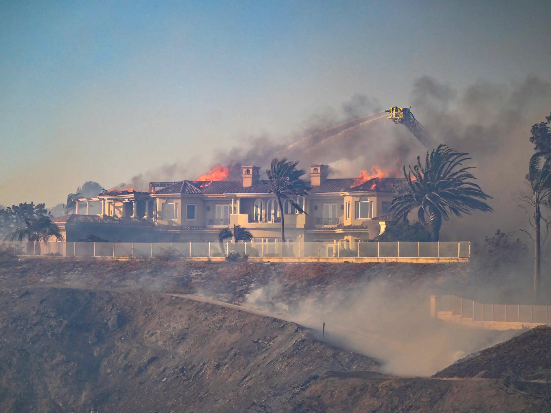 A wildfire is burning multimilliondollar homes in California's Orange