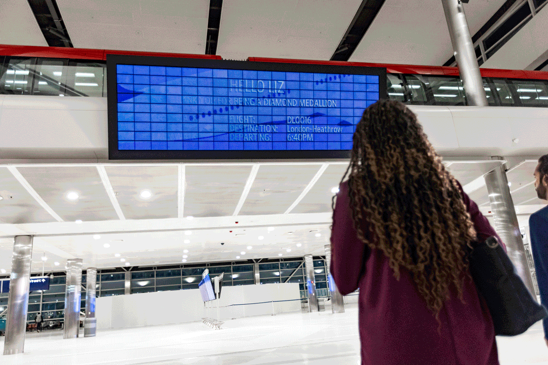 Delta's futuristic new airport screen uses facial recognition to show personalized flight info