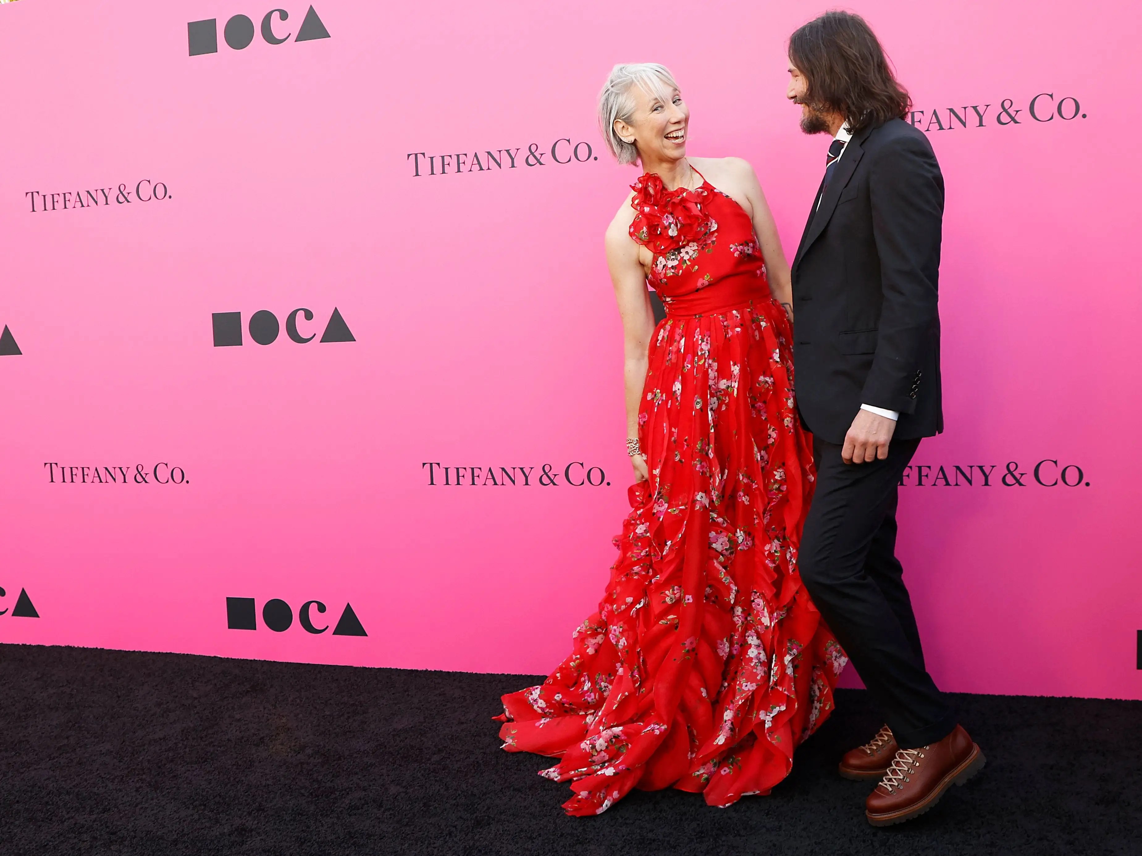 Keanu Reeves and his girlfriend Alexandra Grant share a kiss in a rare