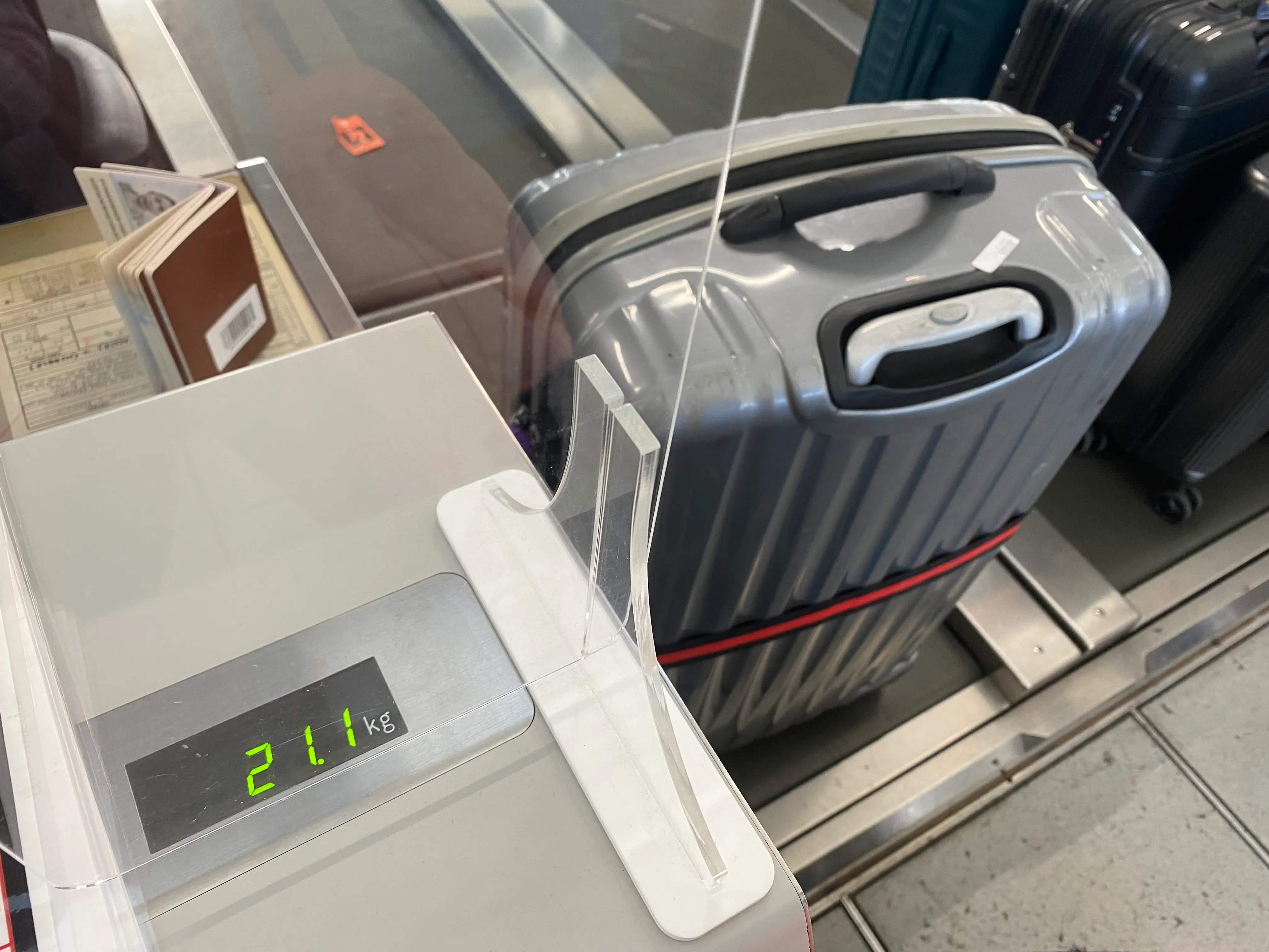 TikTok Is Split on Person Using Foot to Make Luggage Lighter on Scale