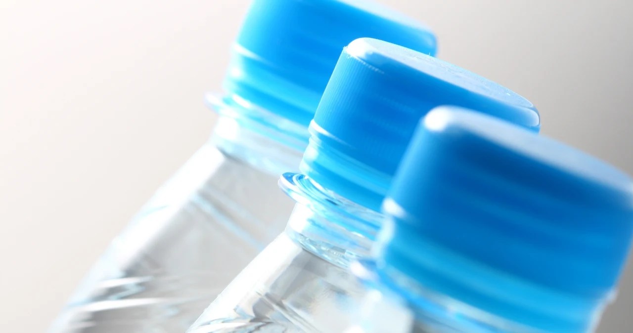 New caps on bottles. Why are they permanently attached?