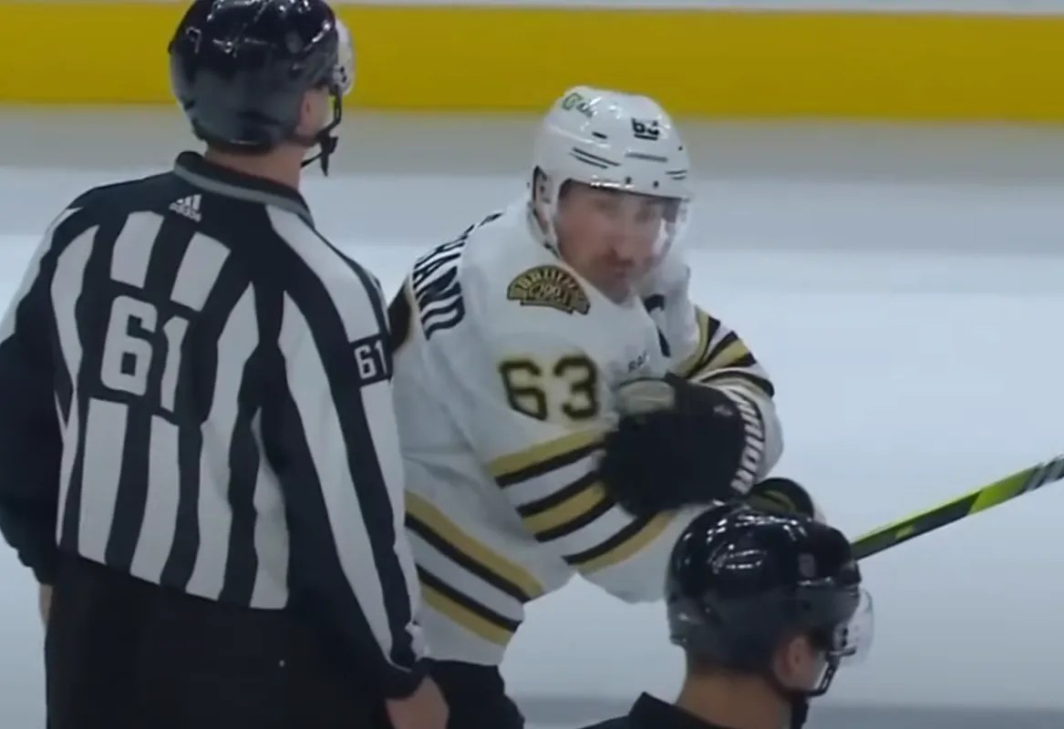 Marchand reacts with anger to the referee after a terrible call