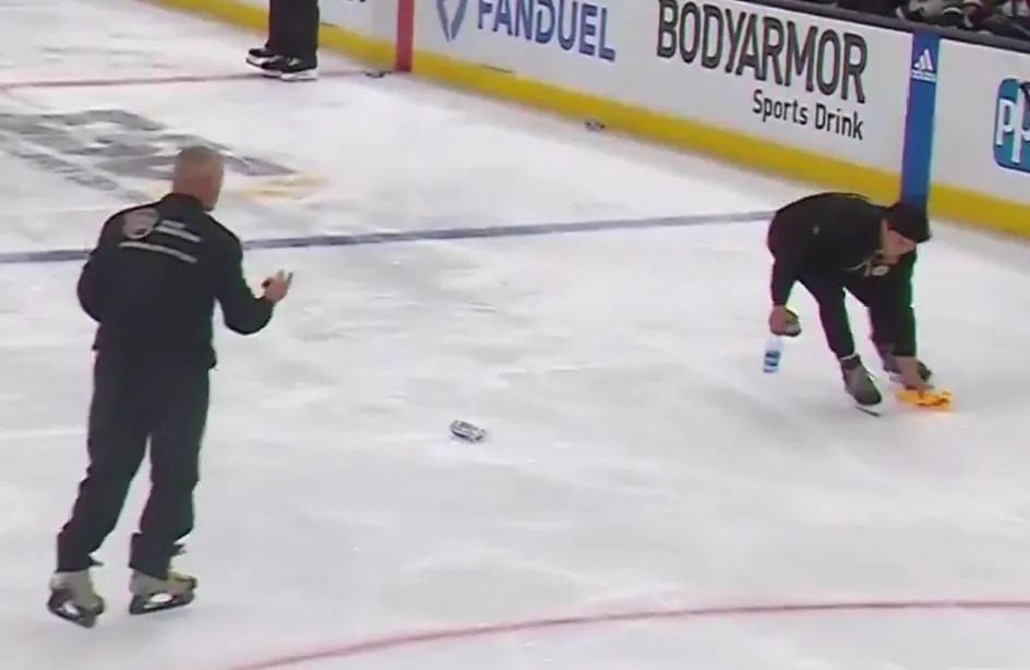 Bruins fans throw trash on the ice after penalty call on Jakub Lauko