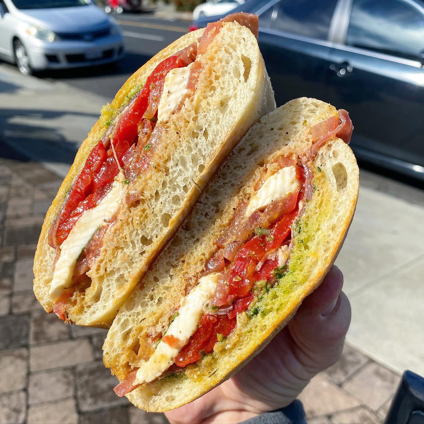 [i ate] this prosciutto wet mozzarella pesto and roasted red pepper