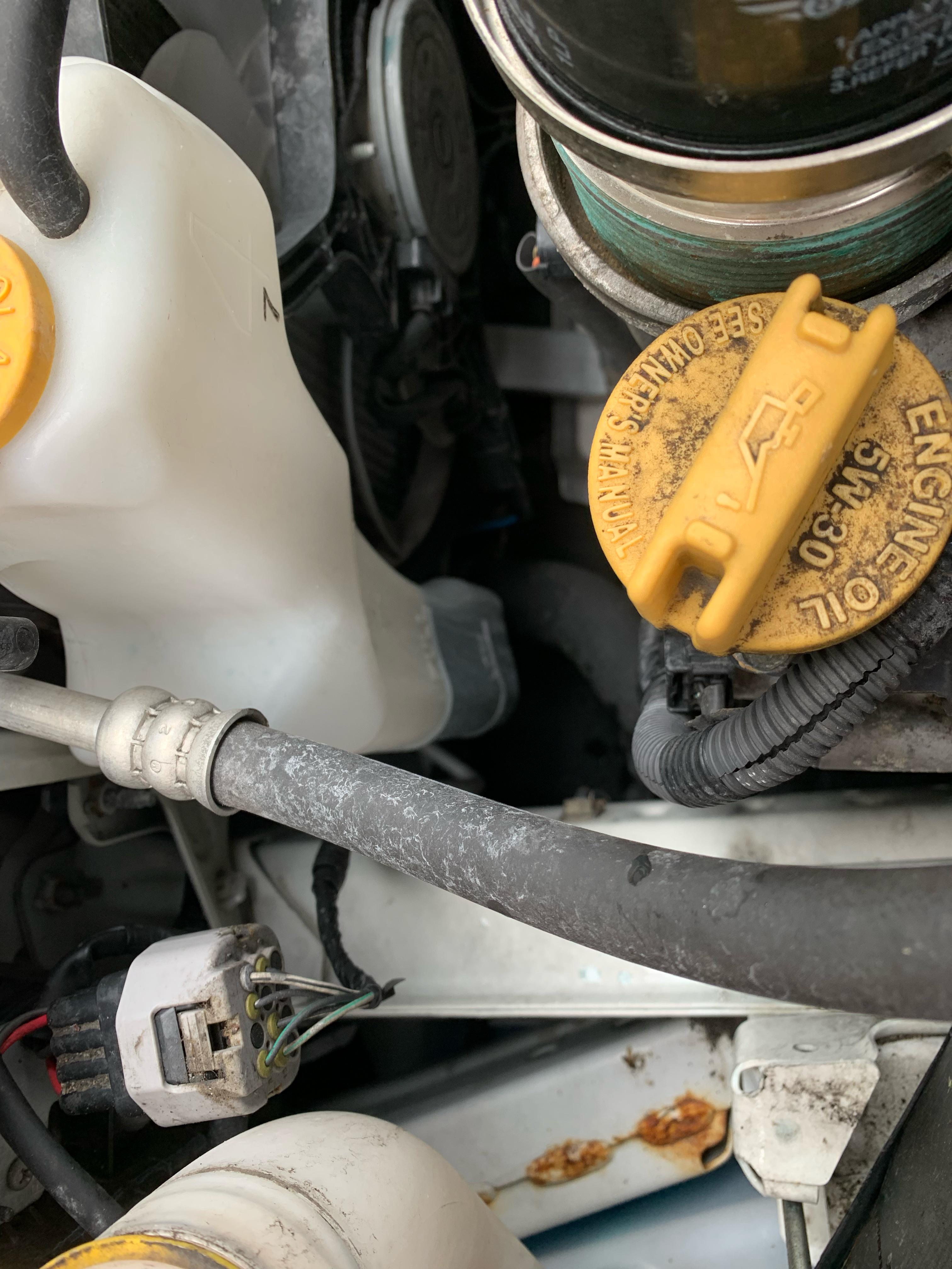 Coolant reservoir slowly makes its way to the low line? No leak under