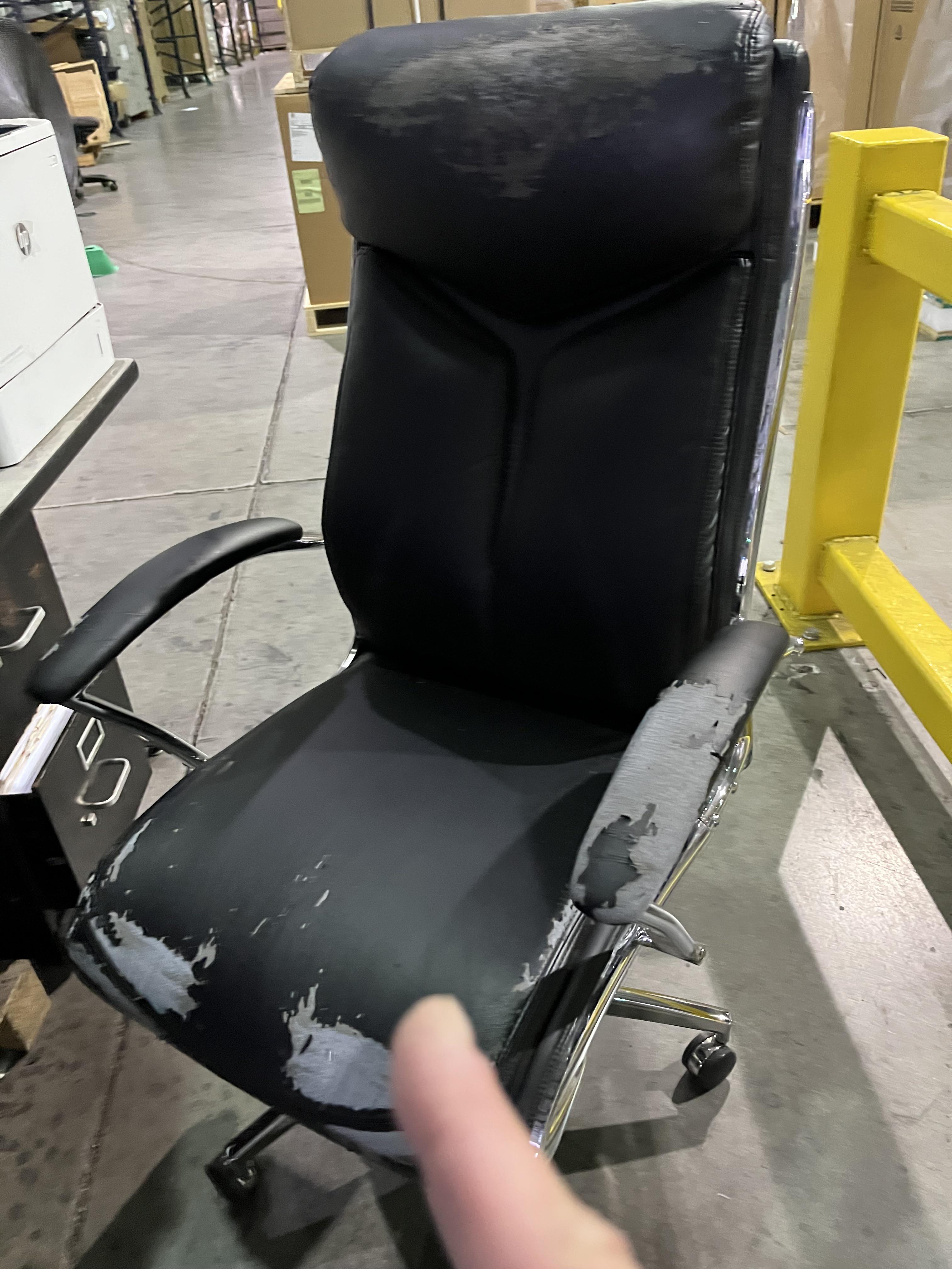 A few people fell off a chair in the warehouse because the seat was