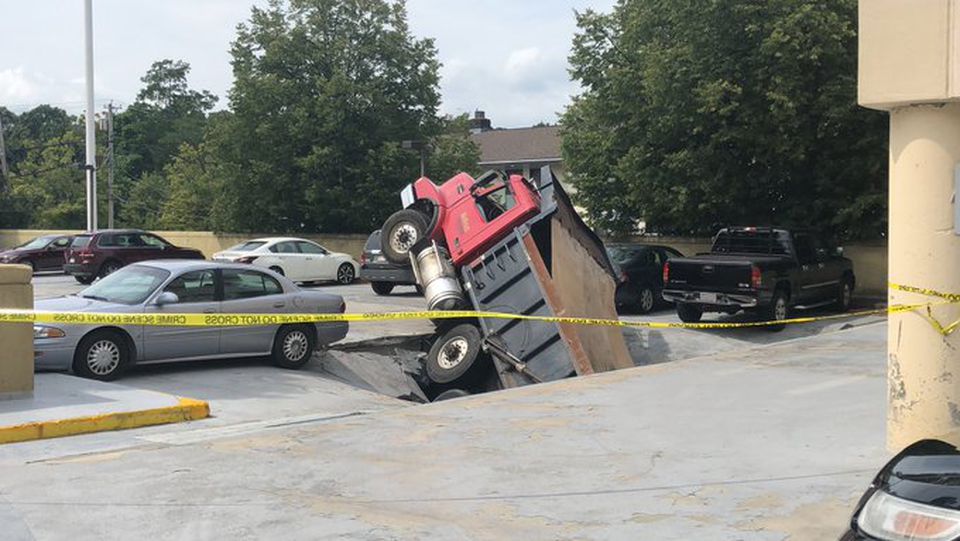 Dump truck falls through roof of parking garage in Quincy, MA 21