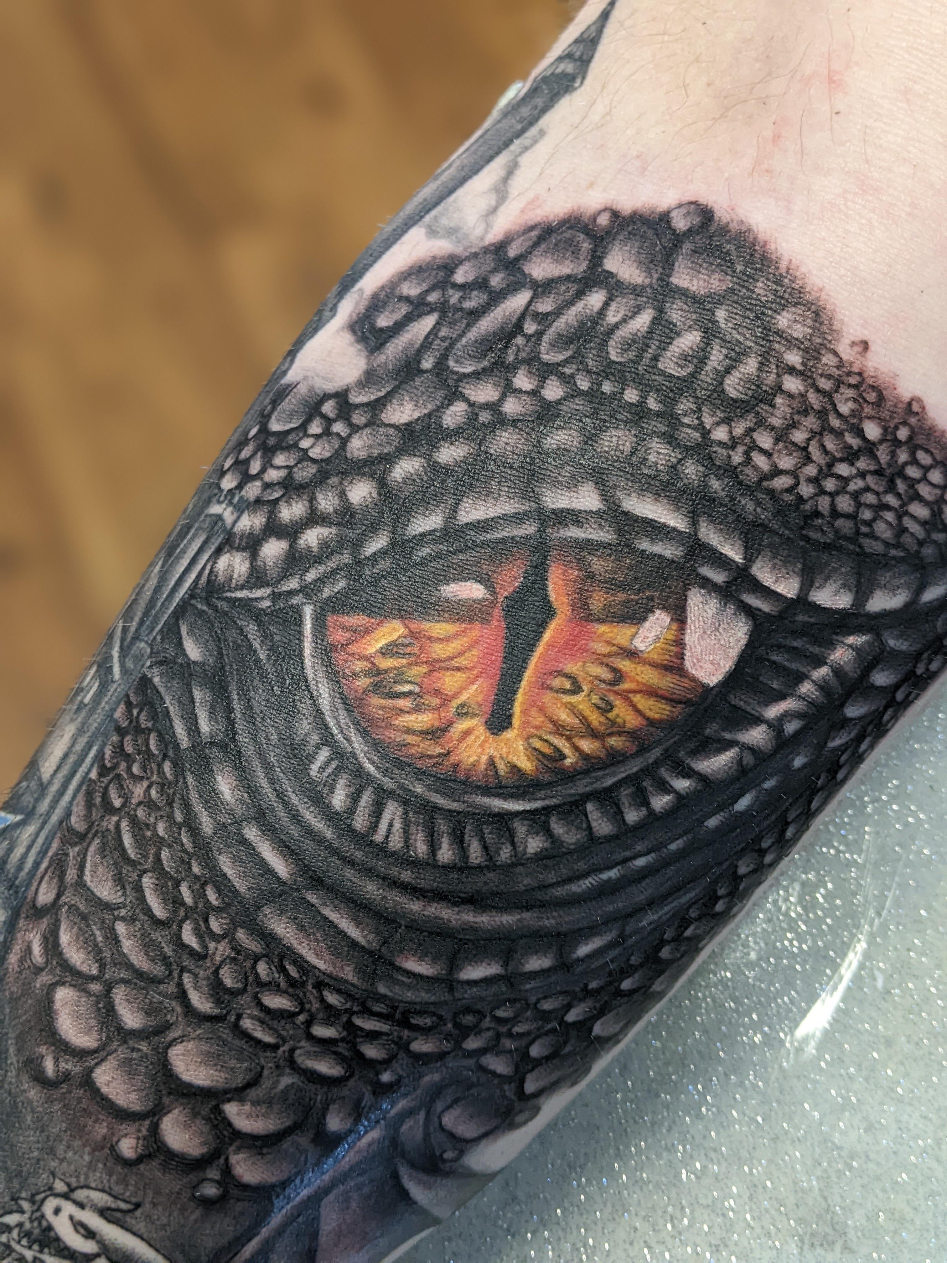 Dragon’s eye by Narnia at Drawing Board Tattoo Co. in Asheville, NC r