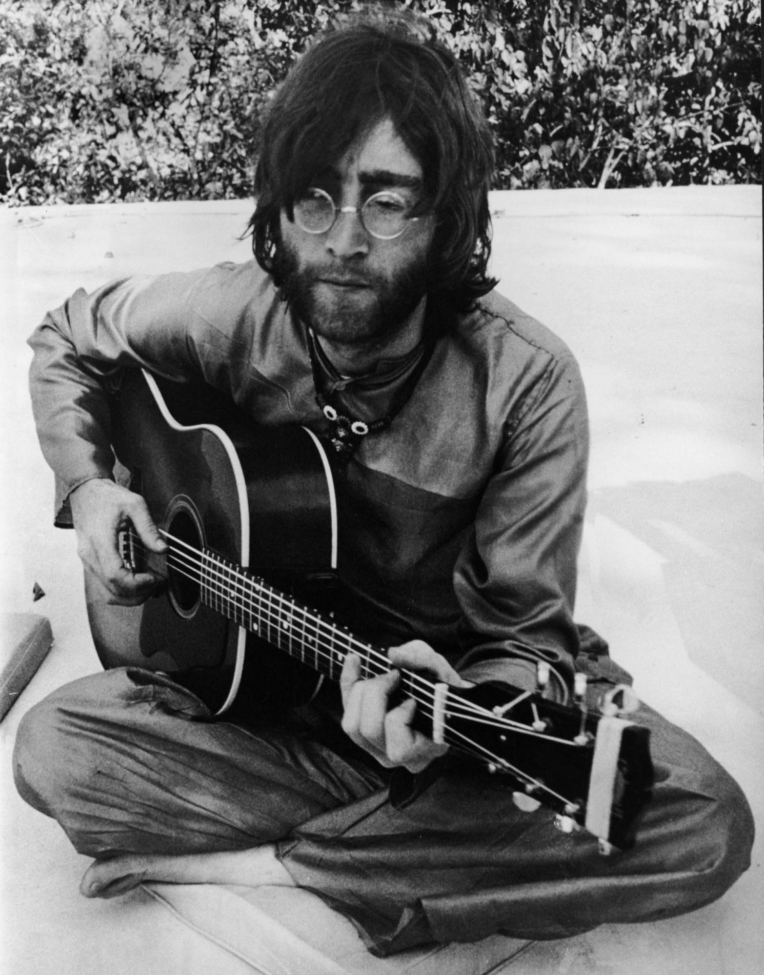 John practising the clawhammer, fingerpicking guitar style he had