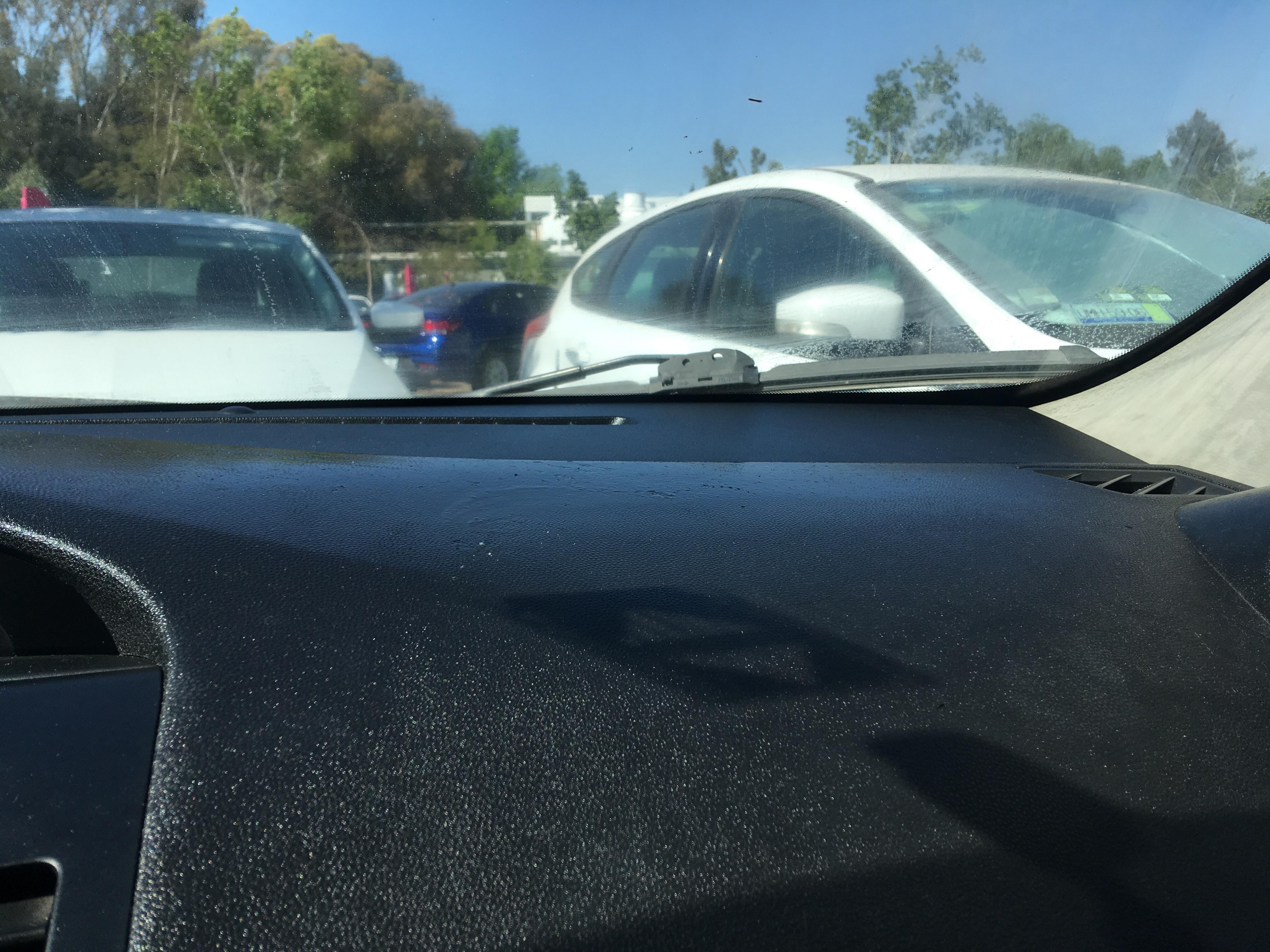 Black, sticky and shiny thing that I can't remove from my car dashboard