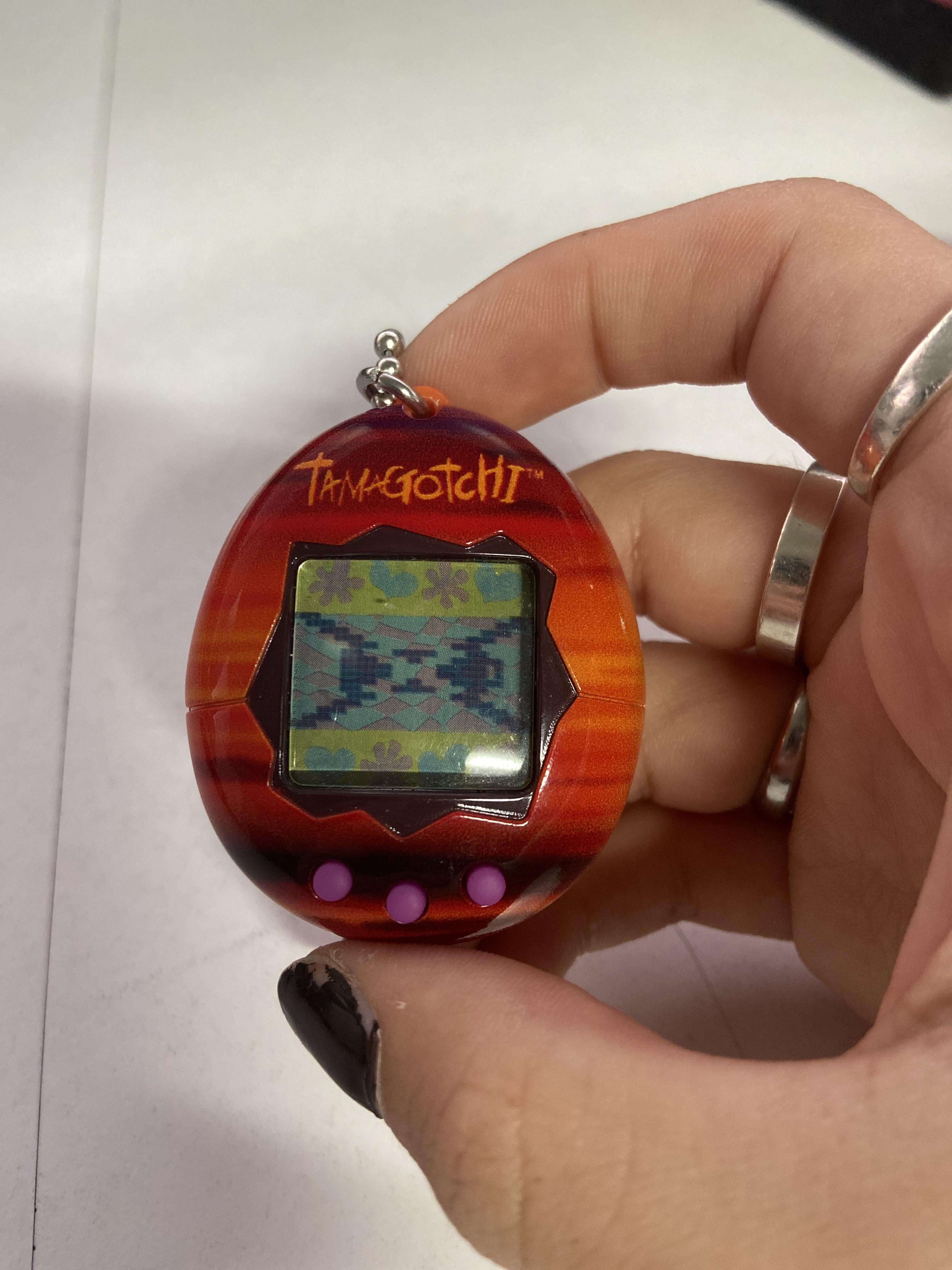 i need heeeeelp. i'm trying to reset my tamagotchi but it keeps going