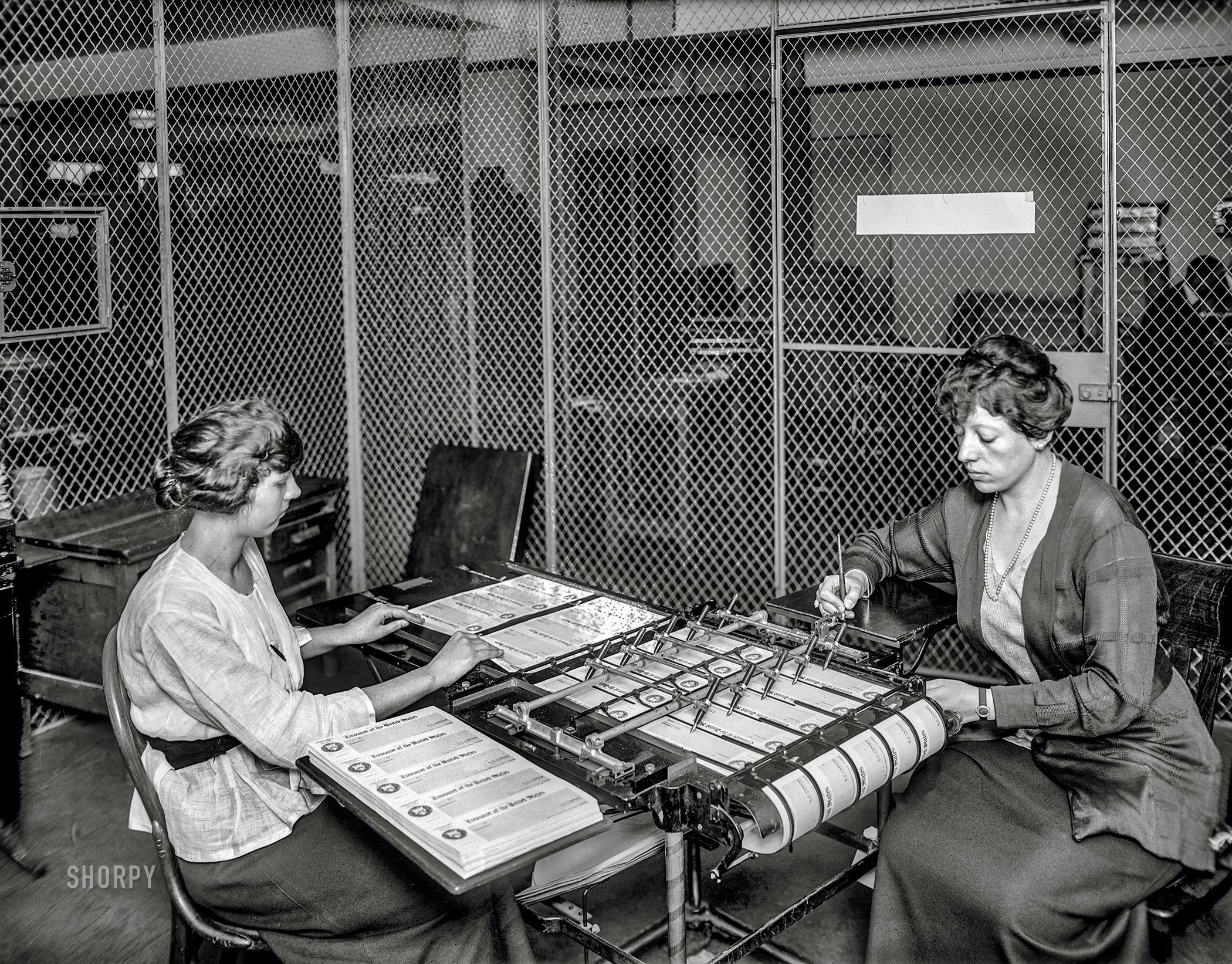 The days before computers. Clerk using an 'Autopen Signature Machine