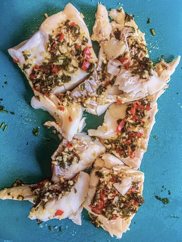 Steamed cod fish fillet with coriander, fish sauce, lemon garlic