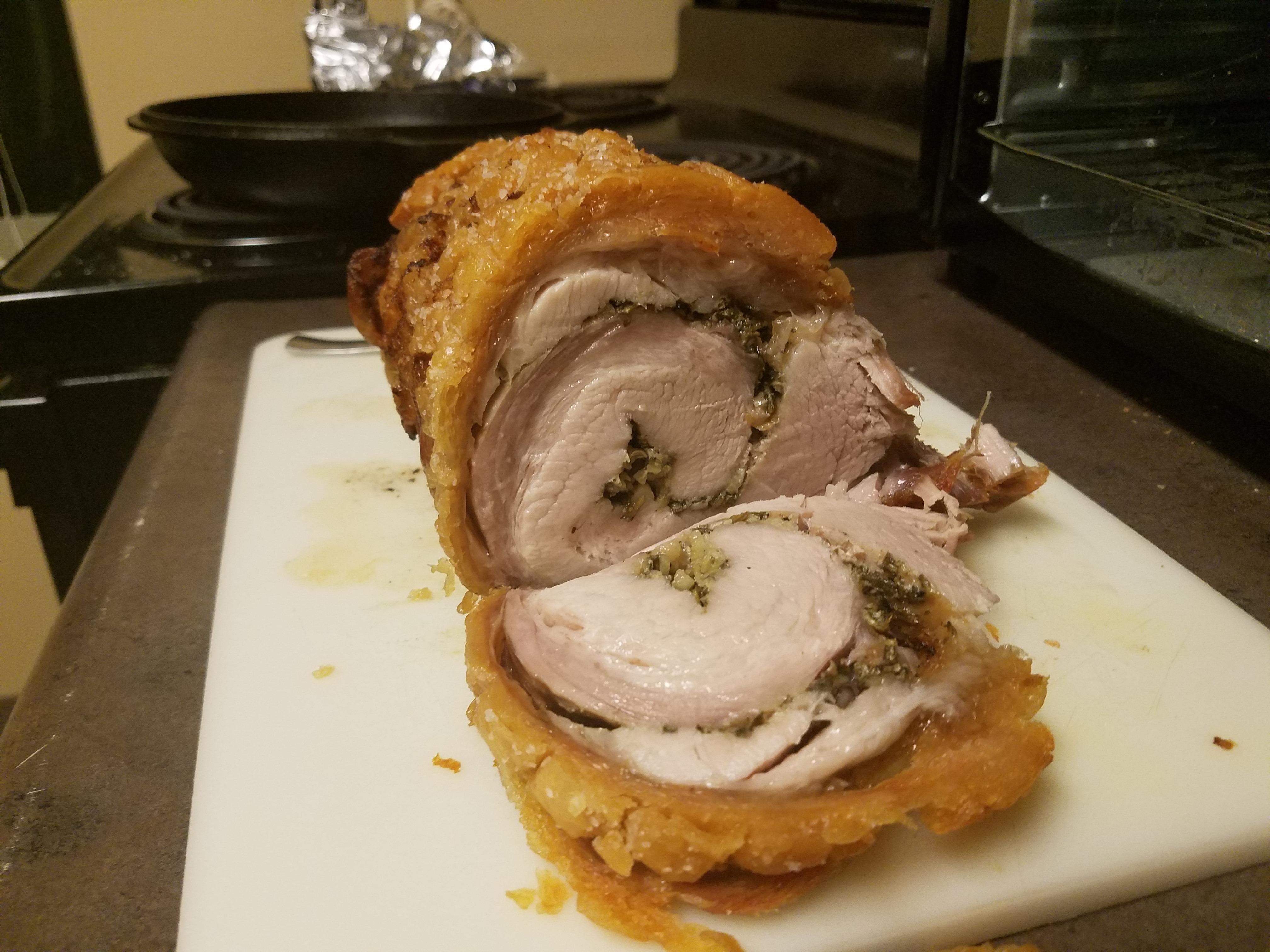 Porchetta stuffed with fresh thyme, rosemary, sage, fennel and garlic
