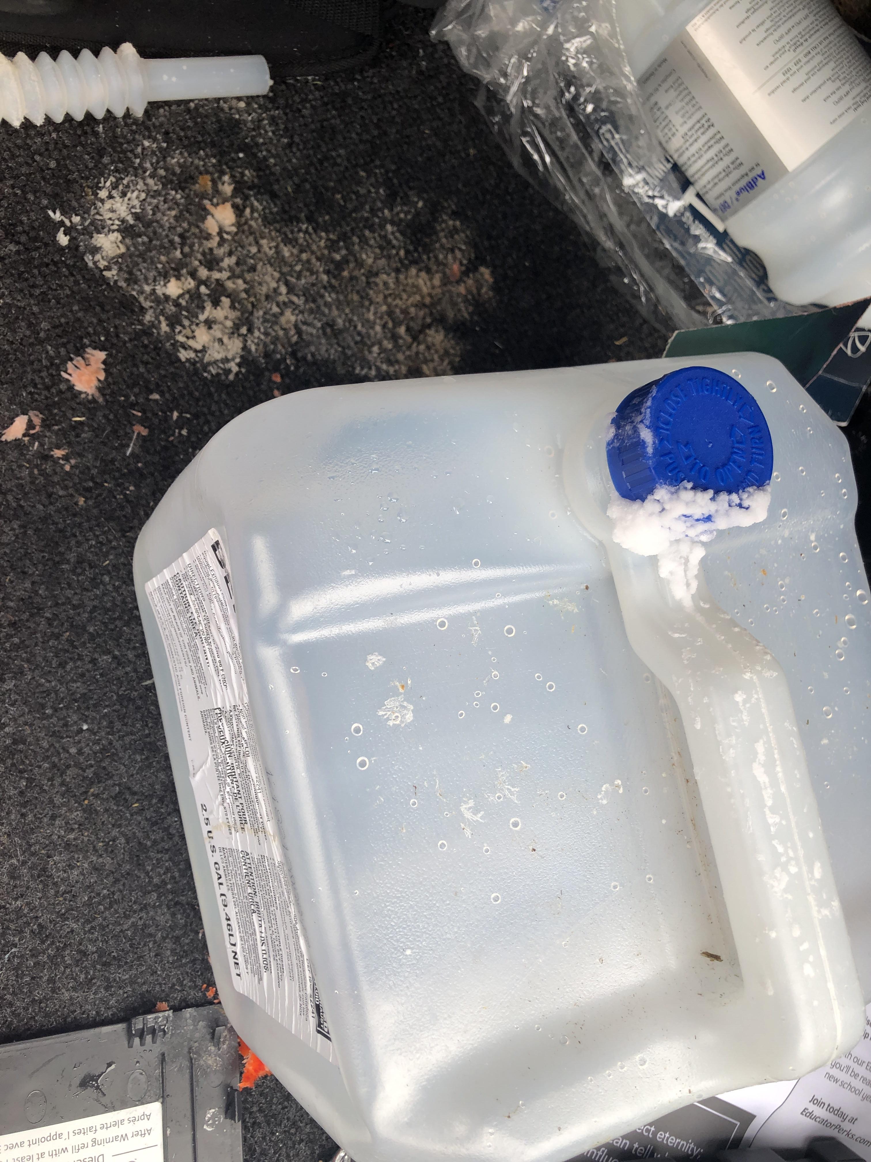 Spilled adblue in back of car. It has crystallized. How should I go