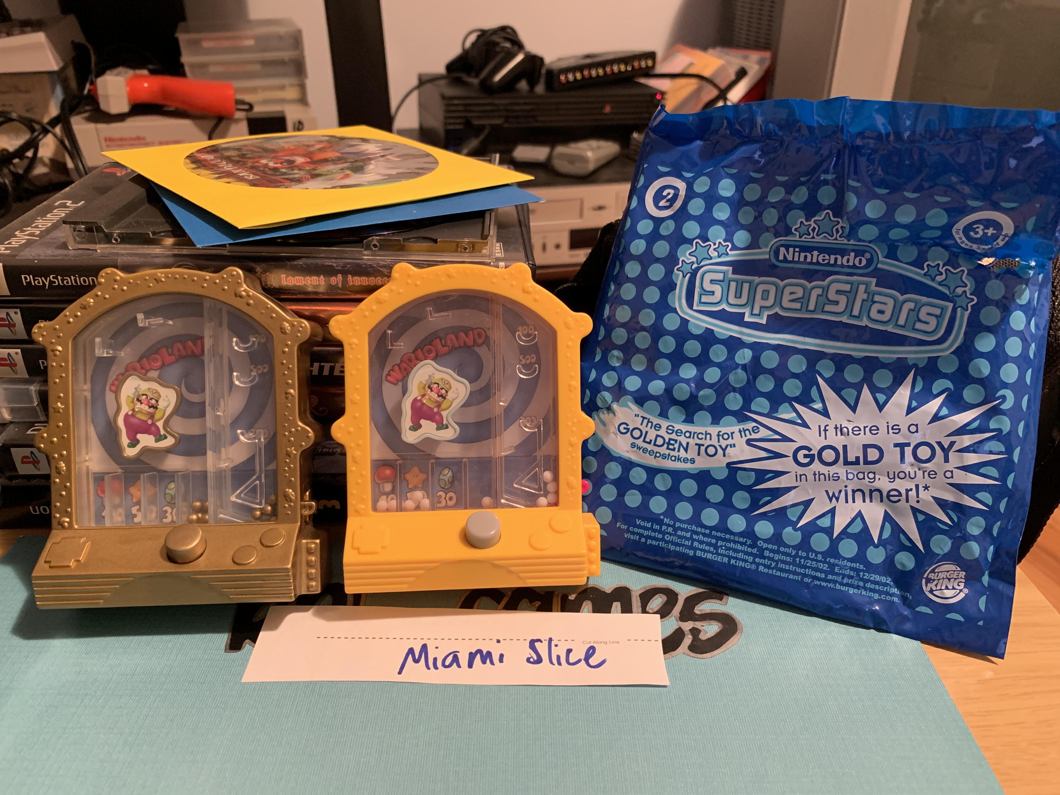 On the left is a gold toy from the Burger King Nintendo SuperStars
