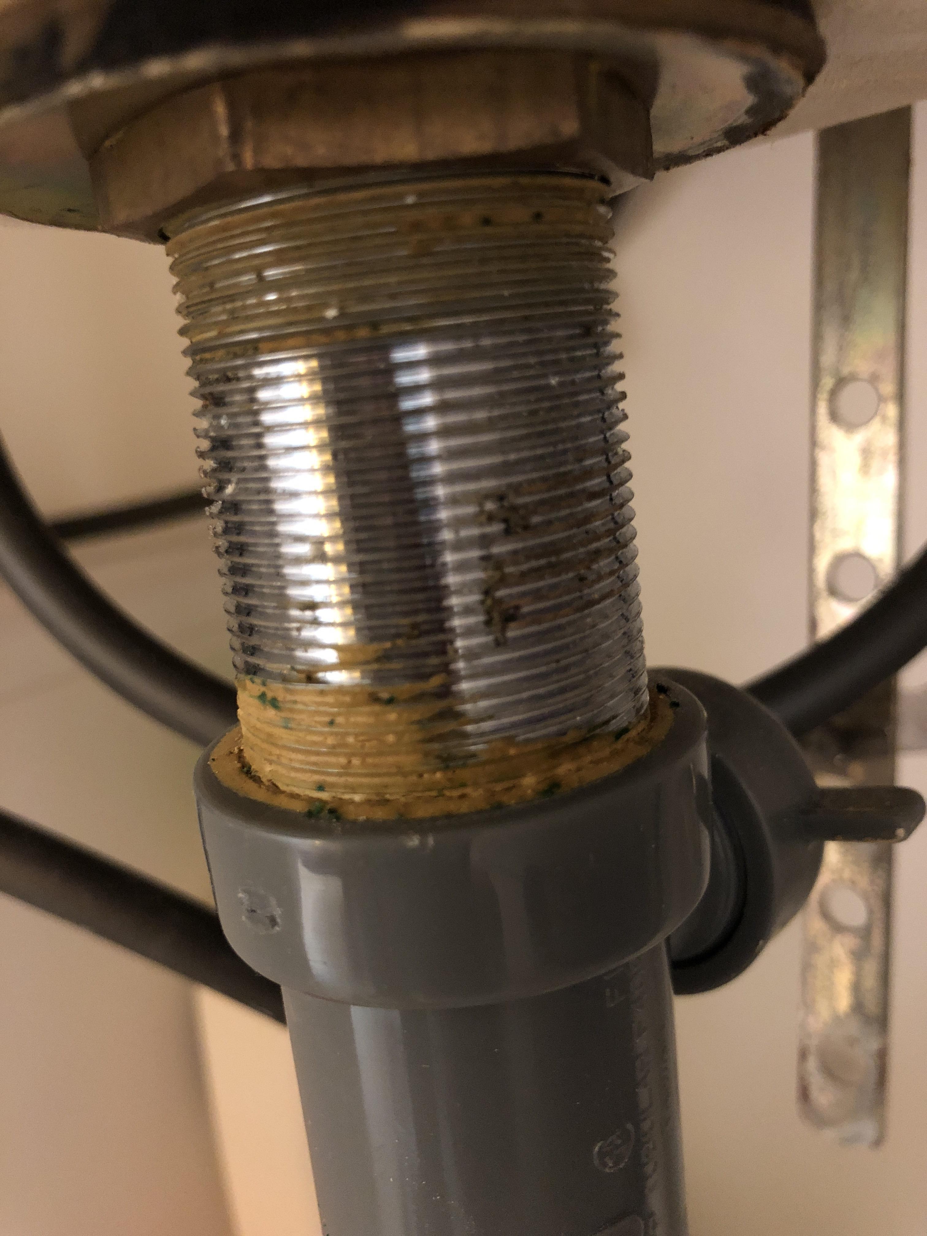 What’s this yellow junk? Feels rubbery. Sealant? r/Plumbing