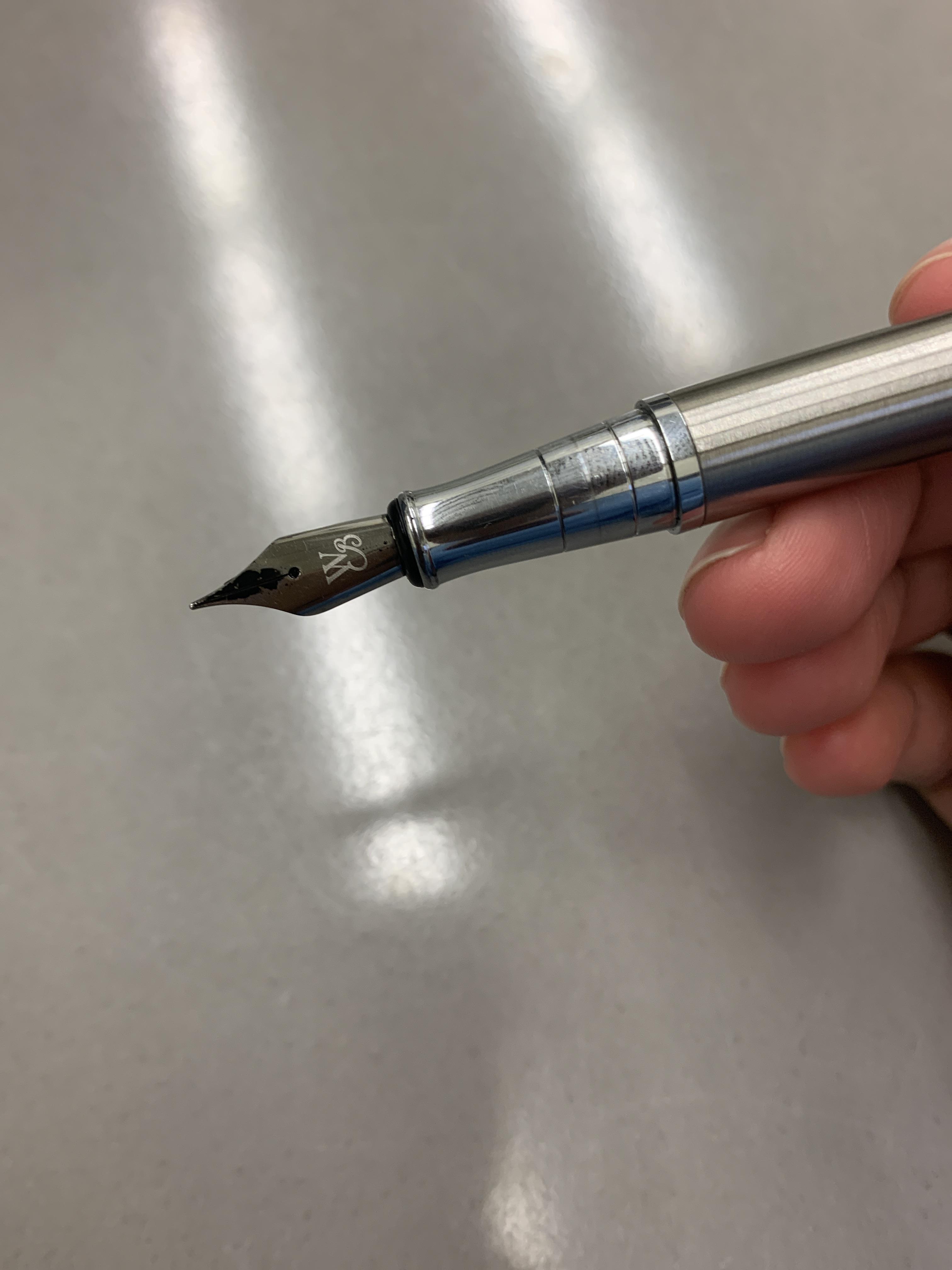 When I write with my pen ink comes out of the top. Is it suppose to do