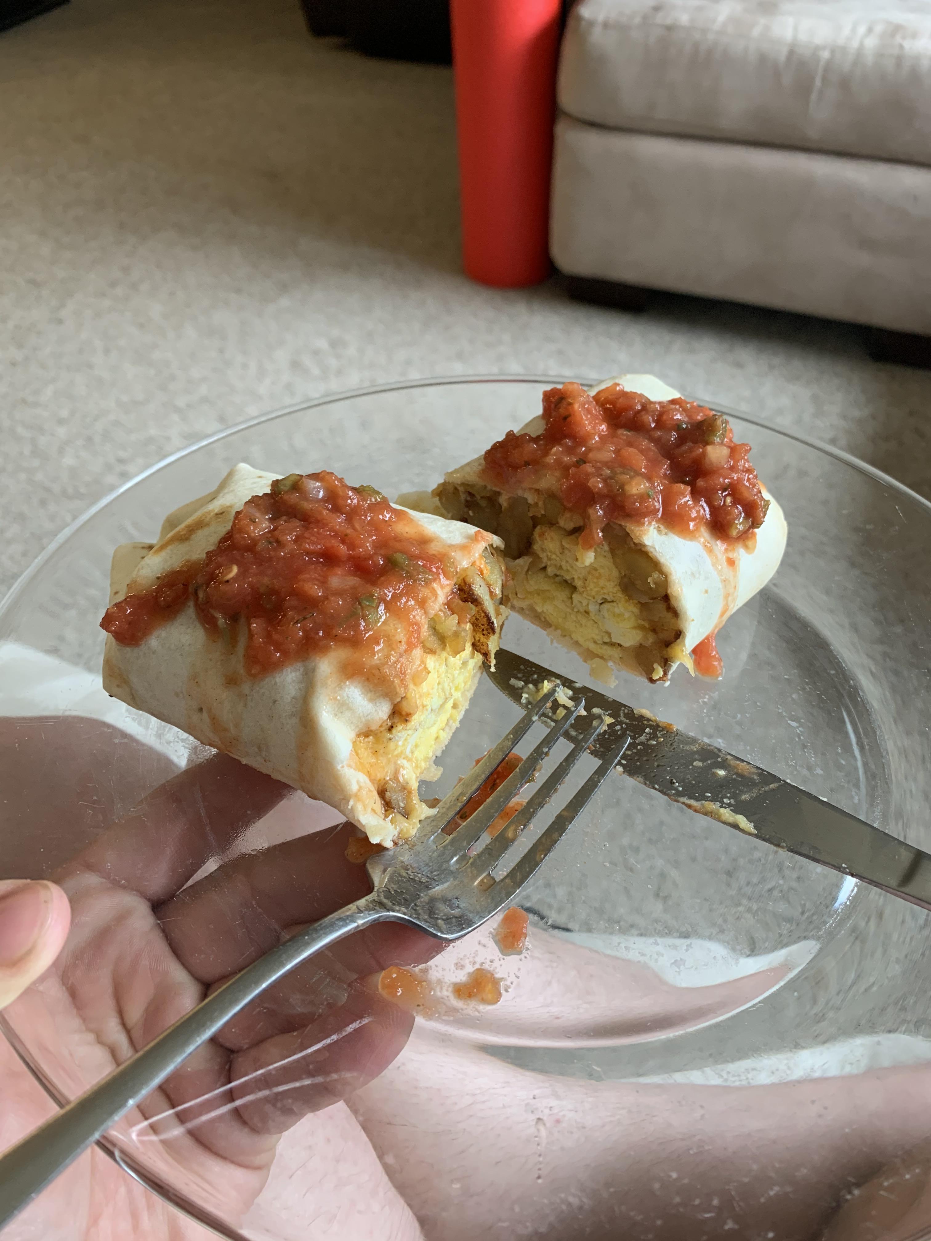 Breakfast burrito with Tapatio soaked home fries and scrambled eggs